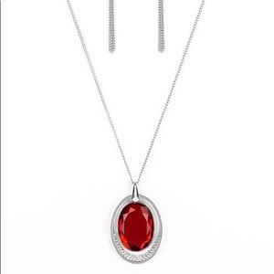 Large red rhinestone pendant on long silver chain